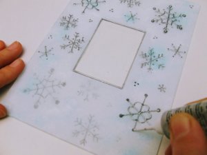 Hópelyhekkel díszített fényképtartó